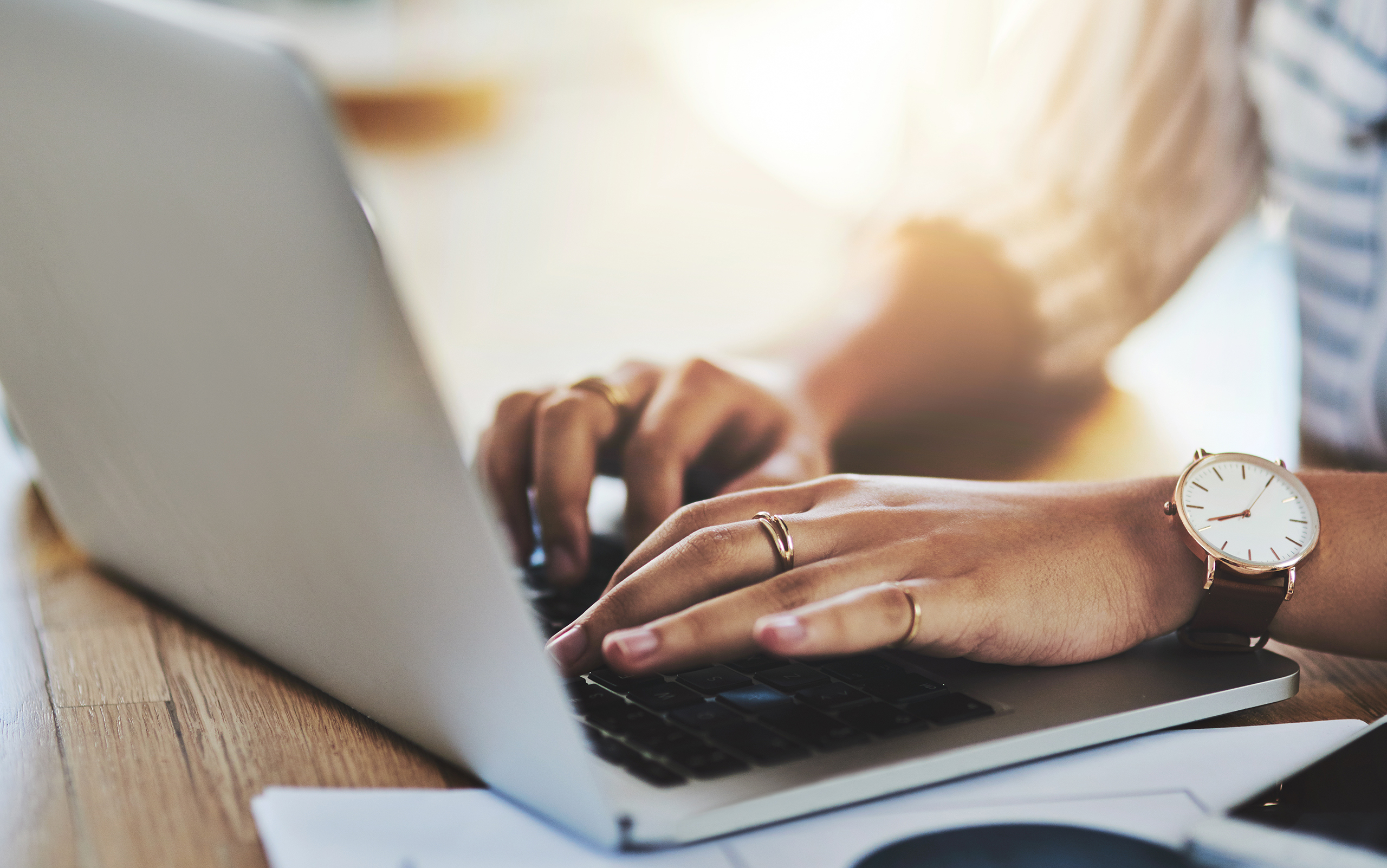 Alkass Dental of Waterford, Michigan, has launched a new website, as represented by this image of a person using a laptop.